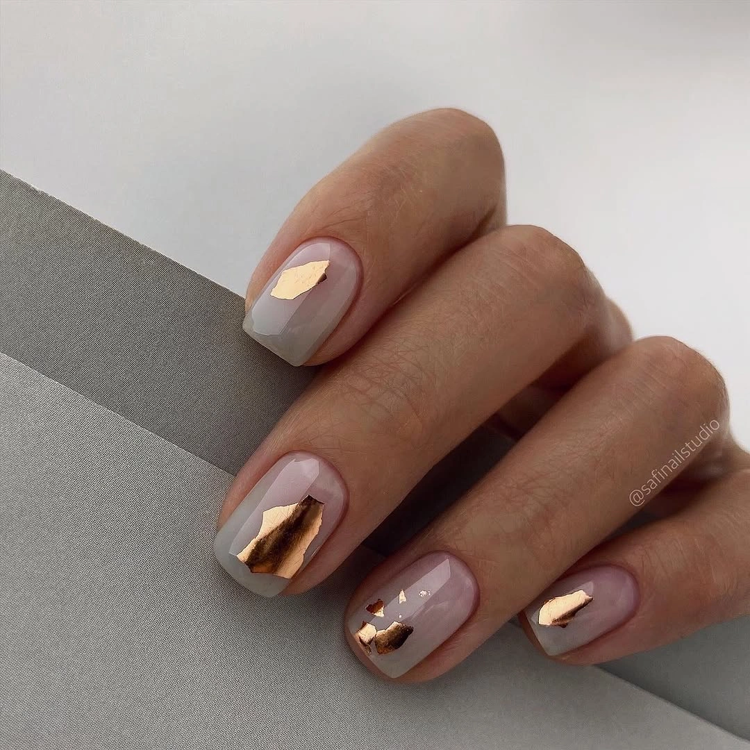 nude fall nails 2026 Greige Nude Nails With Gold Foil