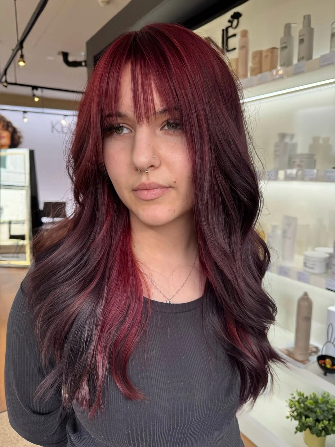 october haircut ideas 2026 Burgundy Layers With Wispy Bangs