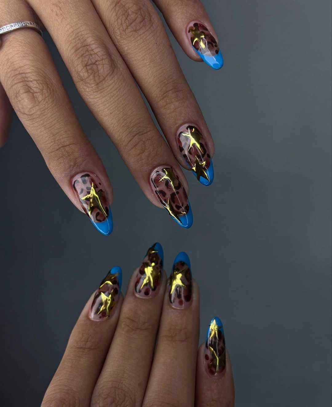 october nail colours 2026 Leopard Nails with Electric Blue Tips