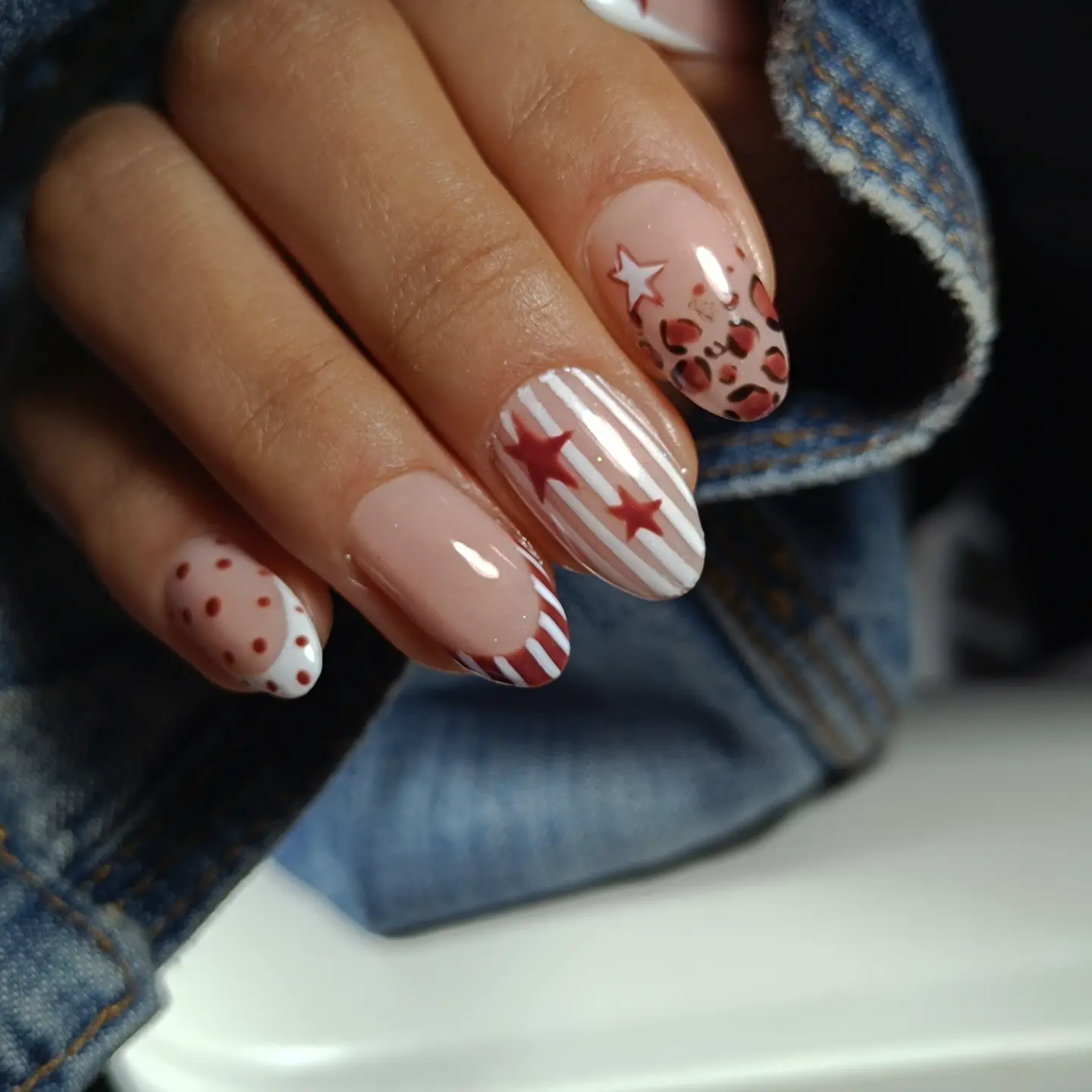 october nails design 2026 Rust Red Stars and Playful Stripes