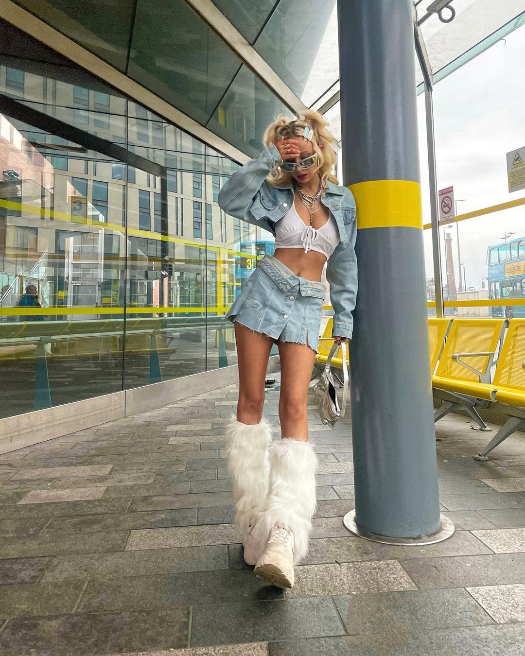 Streetwear Ready: Denim Mini Skirt with Voluminous Faux Fur Leg Warmers — Leg Warmers Outfits