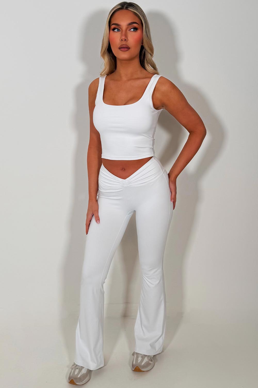 Monochromatic Chic: White Flare Leggings with V-Waist Monochromatic Chic: White Flare Leggings with V-Waist — Flare Leggings Outfits