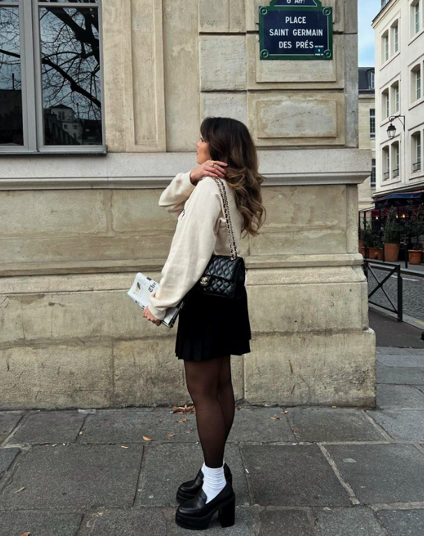 Black Pleated Mini Skirt with Beige Sweatshirt and Platform Loafers — Winter Skirt Outfits