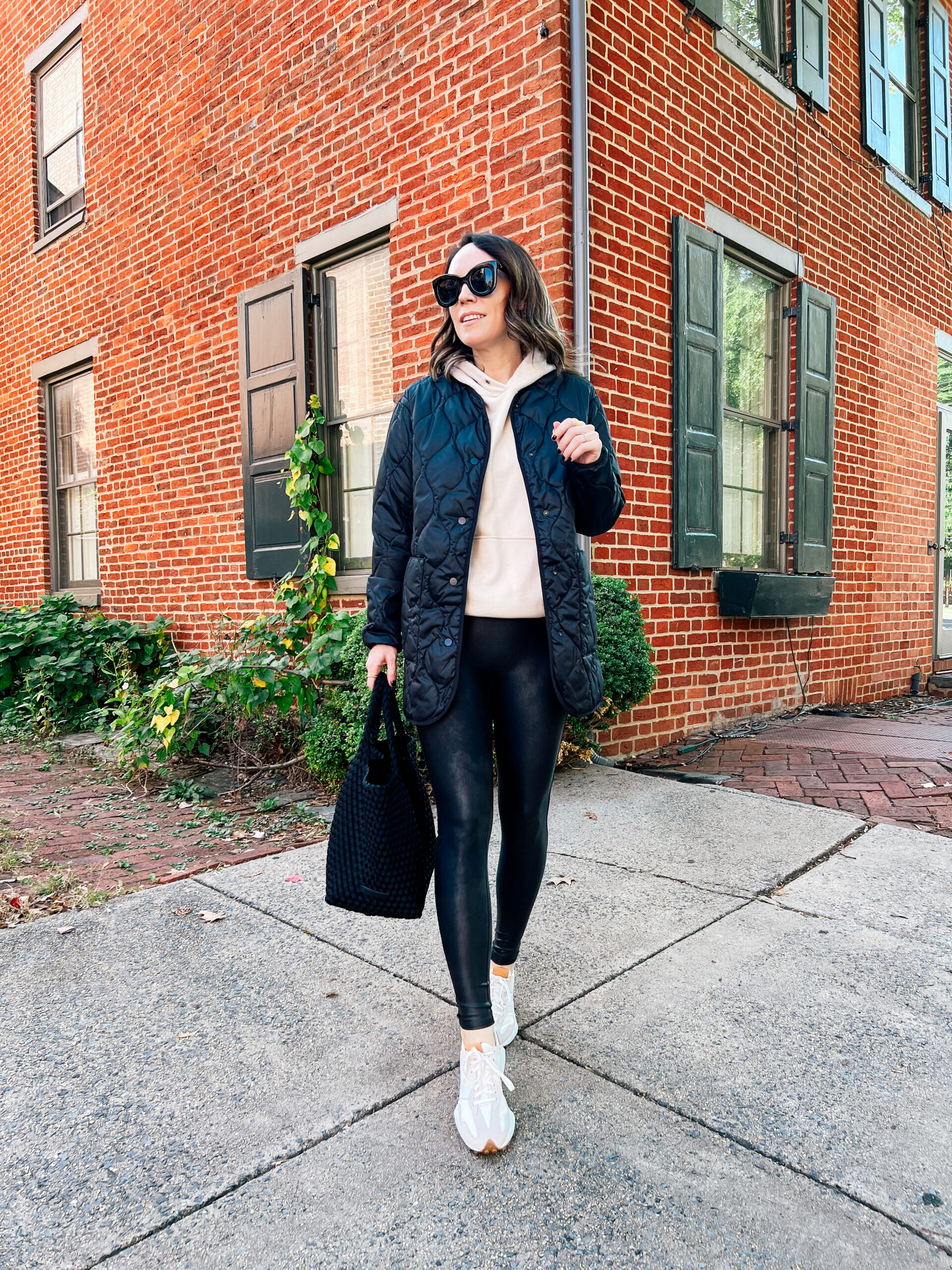 Quilted Black Parka Over a Beige Hoodie — Parka Outfits