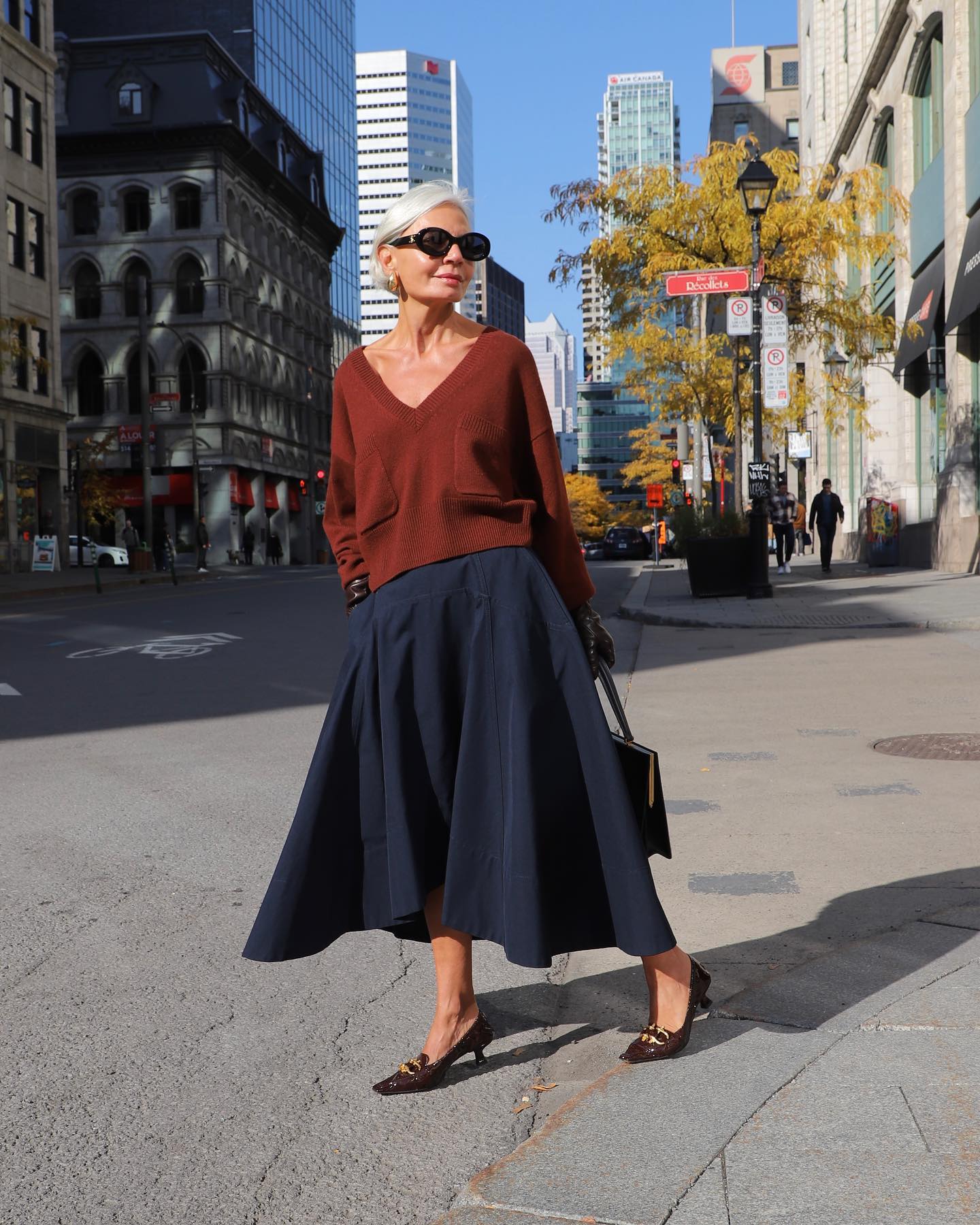 Navy Blue Midi Skirt with Rust Orange V-Neck Sweater — Winter Skirt Outfits