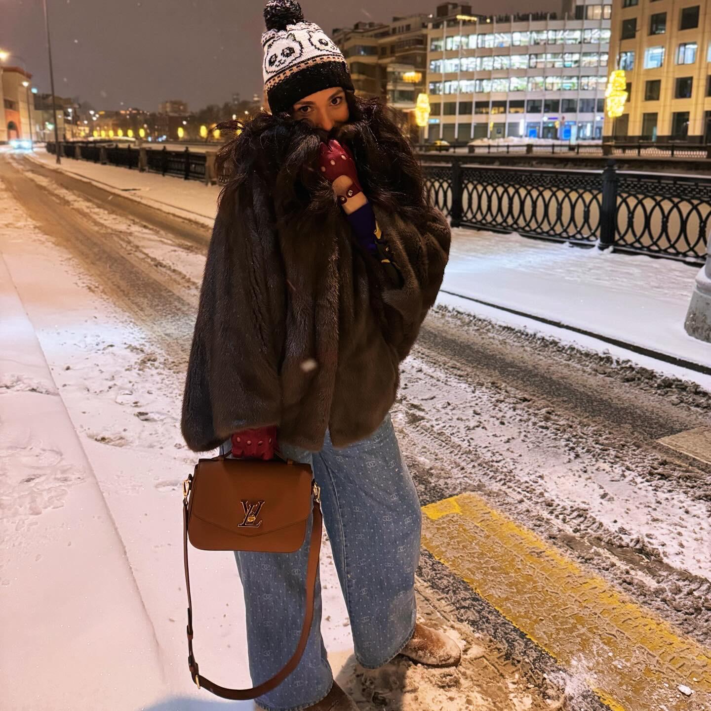Voluminous Fur Coat Meets Denim-Look Trousers in Snowy Setting — Winter Streetwear Outfits
