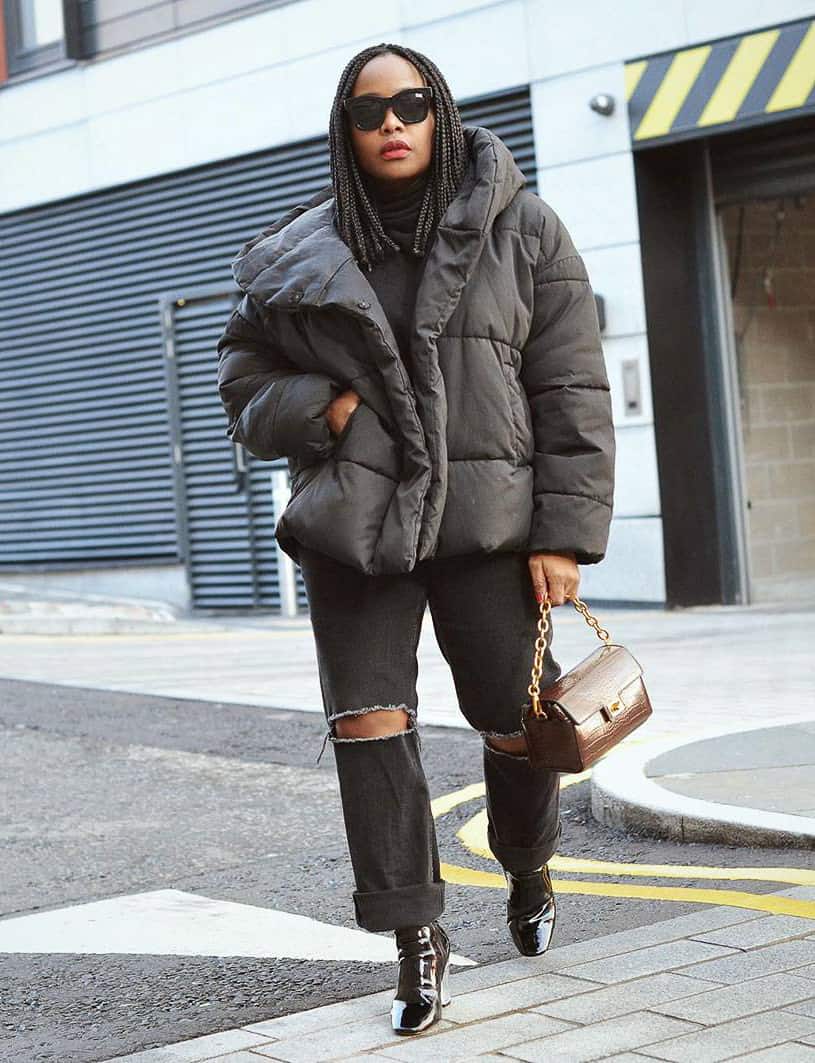 Chunky Puffer Jacket Over Knitwear and Ripped Jeans for Winter Warmth — Winter Concert Outfits