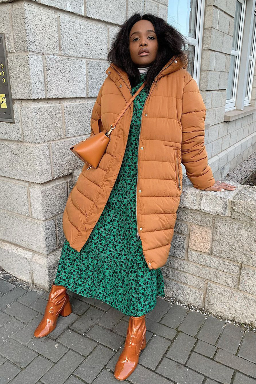 Long Rust Puffer Jacket Paired with a Green Dress and Patent Boots Long Rust Puffer Jacket Paired with a Green Dress and Patent Boots — Winter Puffer Jacket Outfits