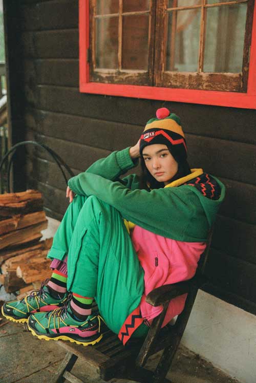 Vibrant Hooded Jacket and Hiking Boots for an Outdoor Aesthetic — Italy Winter Outfits
