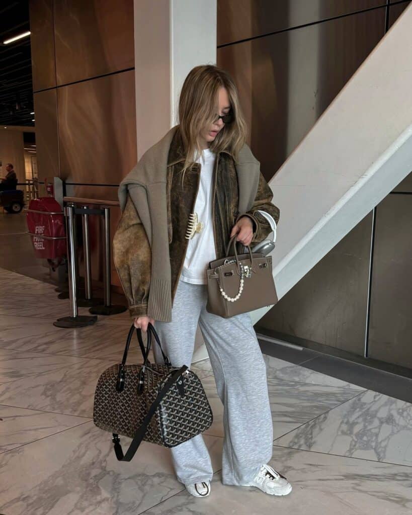 Leather Jacket and Draped Sweater for an Edgy Airport Style Leather Jacket and Draped Sweater for an Edgy Airport Style — Winter Airport Outfits
