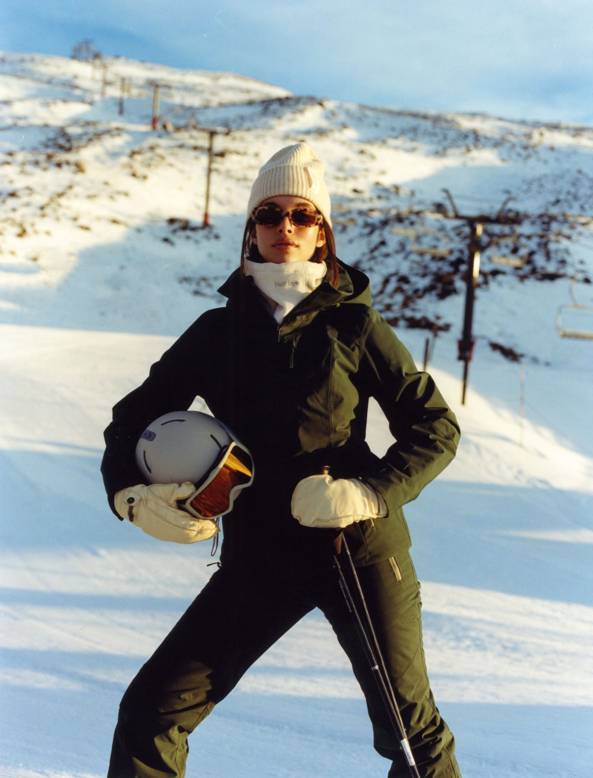 Sleek Dark Green Ski Suit with Bold Accessories for an Active Shoot — Winter Photoshoot Outfits