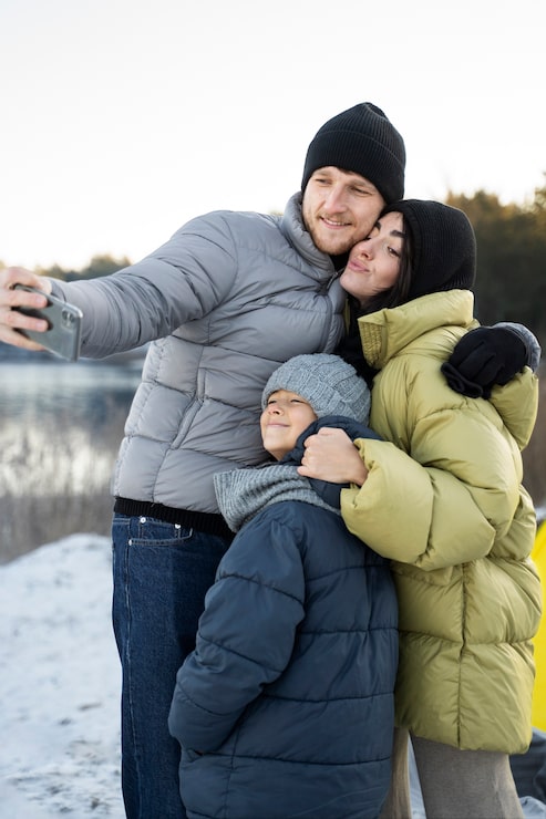 Relaxed Fit Puffer Jackets for a Snowy Selfie Family Portrait Relaxed Fit Puffer Jackets for a Snowy Selfie Family Portrait — Winter Family Photo Outfits