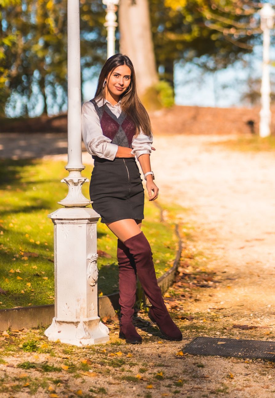 Smart Casual: Burgundy Boots with Argyle Vest and Mini Skirt — Knee High Boots Outfits