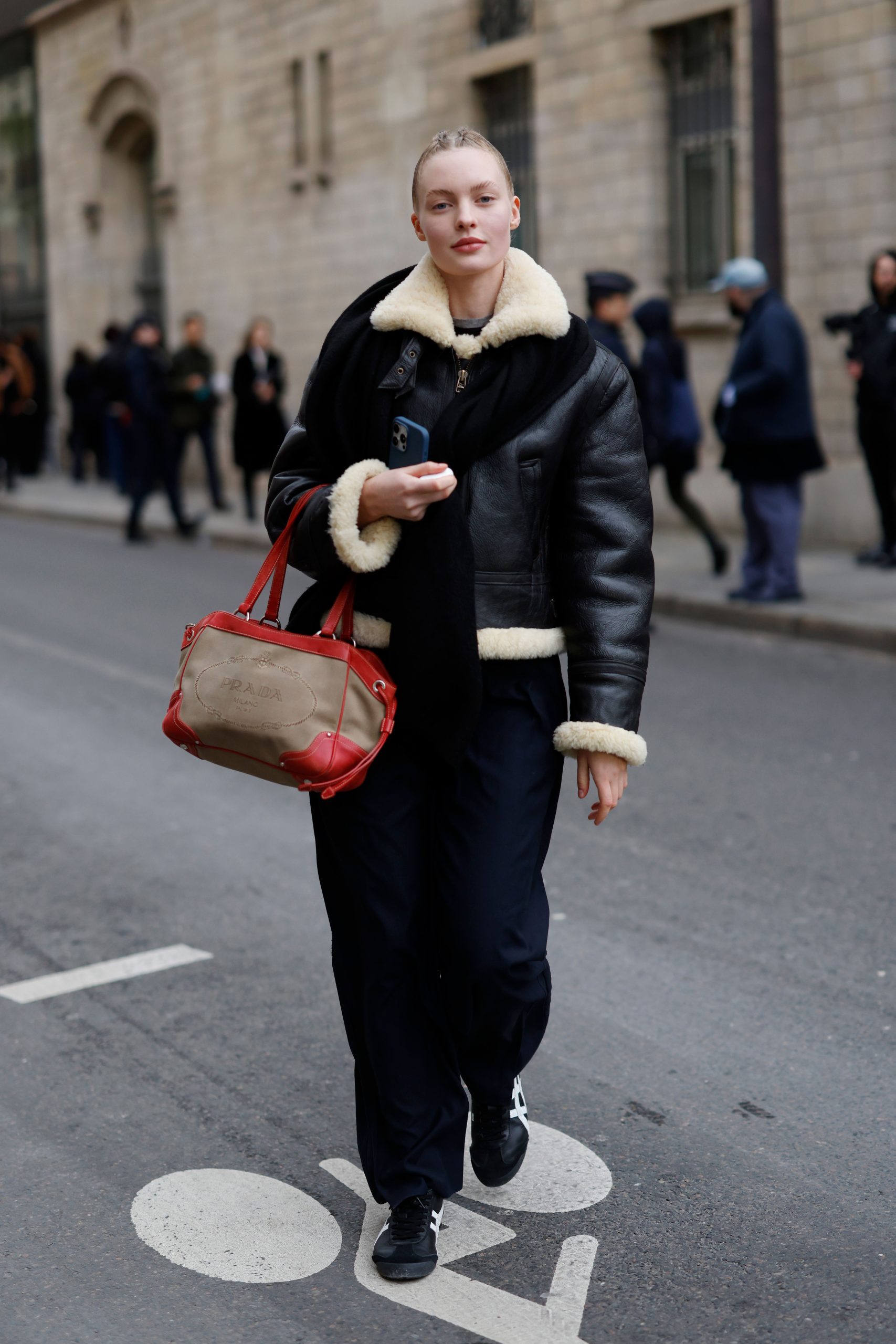 Black Leather Shearling Jacket with Navy Trousers and Red Bag Black Leather Shearling Jacket with Navy Trousers and Red Bag — Shearling Coat Outfits