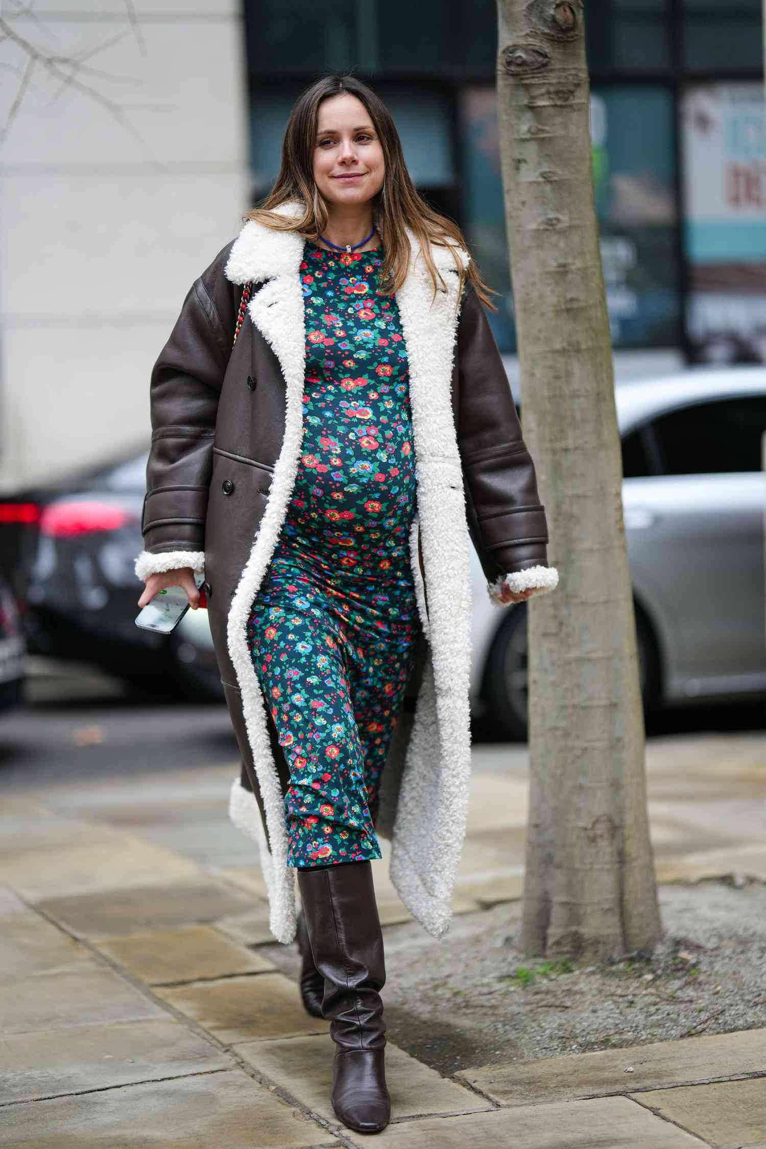 Chic Brown Shearling Coat Over Floral Maternity Dress — Winter Maternity Outfits