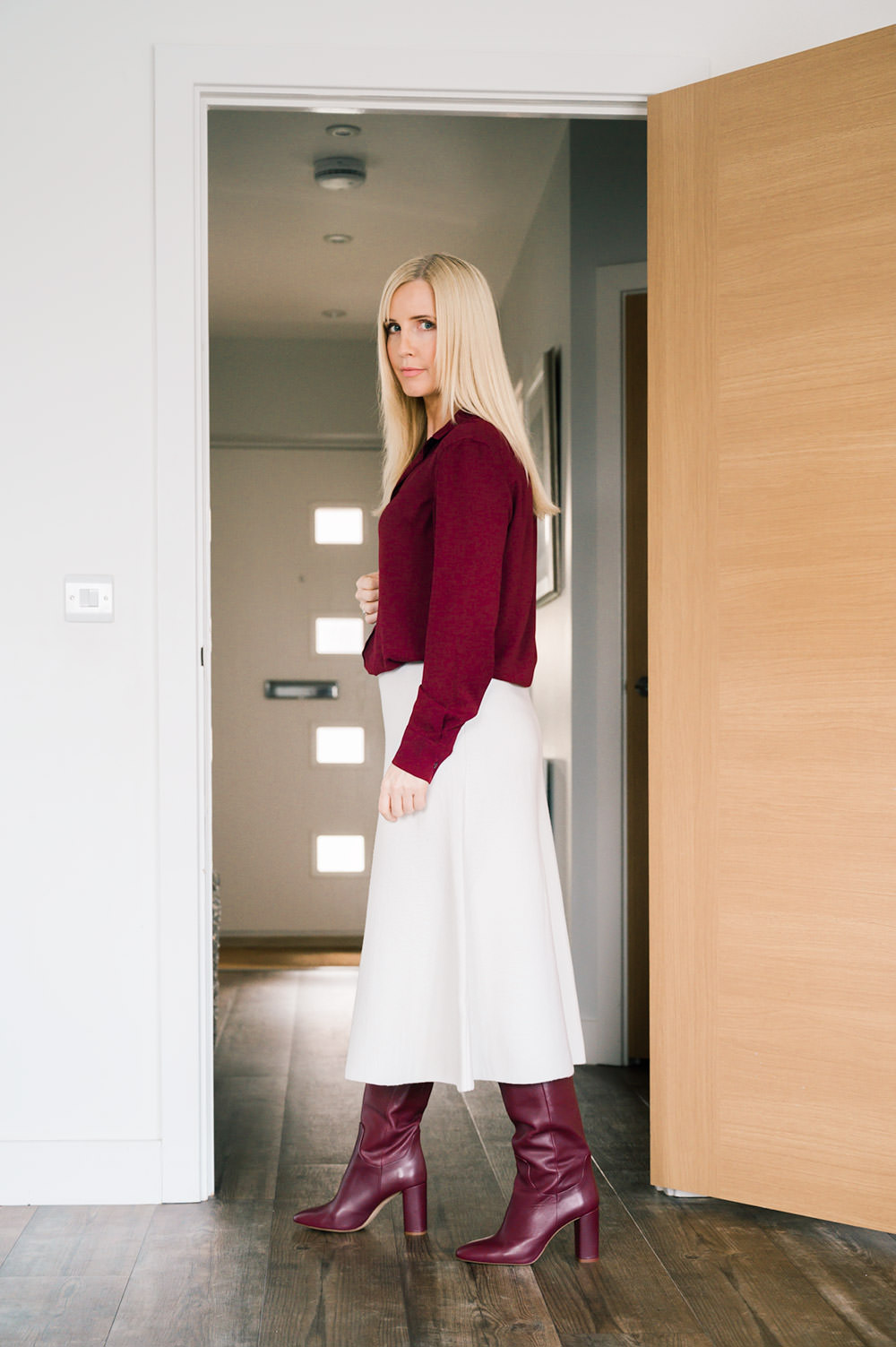 Cream A-Line Midi Skirt with Burgundy Top and Knee-High Boots — Winter Skirt Outfits