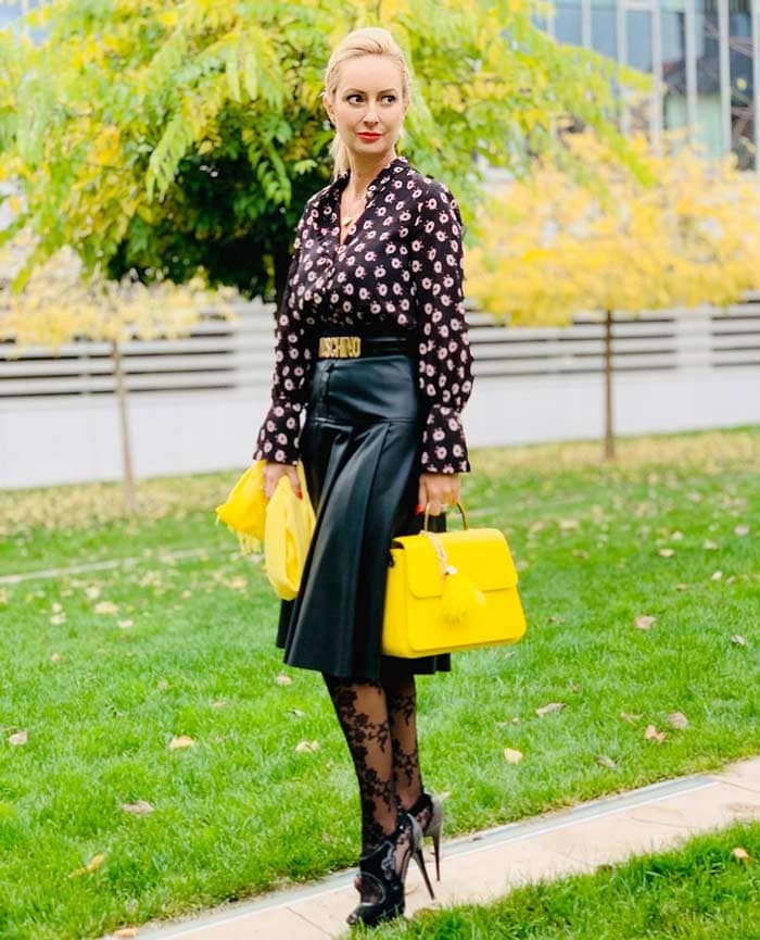 Black Leather Pleated Midi Skirt with Floral Blouse and Yellow Handbag Black Leather Pleated Midi Skirt with Floral Blouse and Yellow Handbag — Leather Skirt Outfits