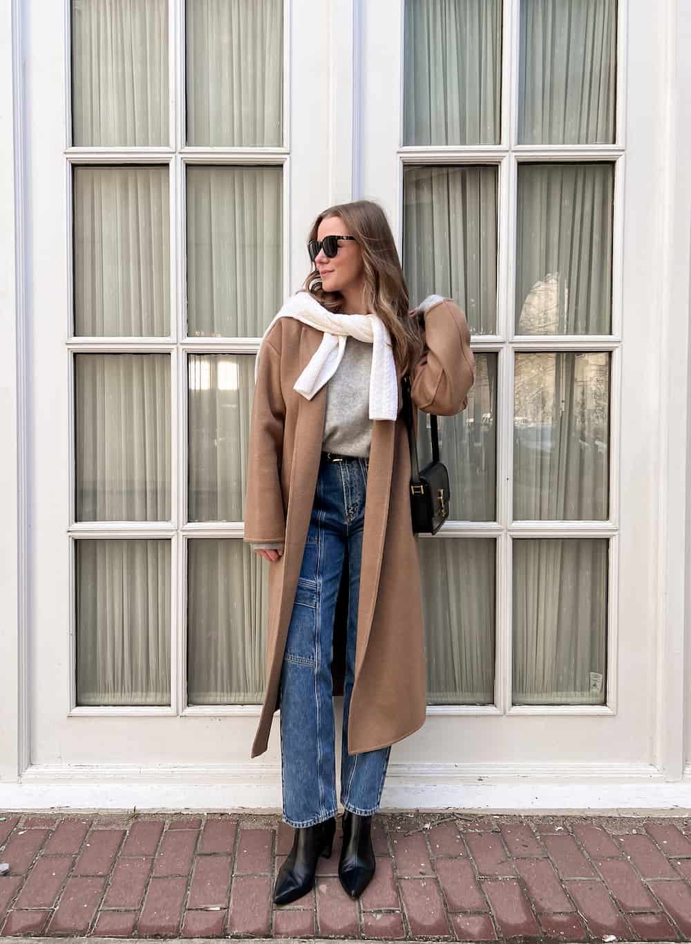 Classic Camel Coat Over Denim and Grey Sweater — Winter Brunch Outfits