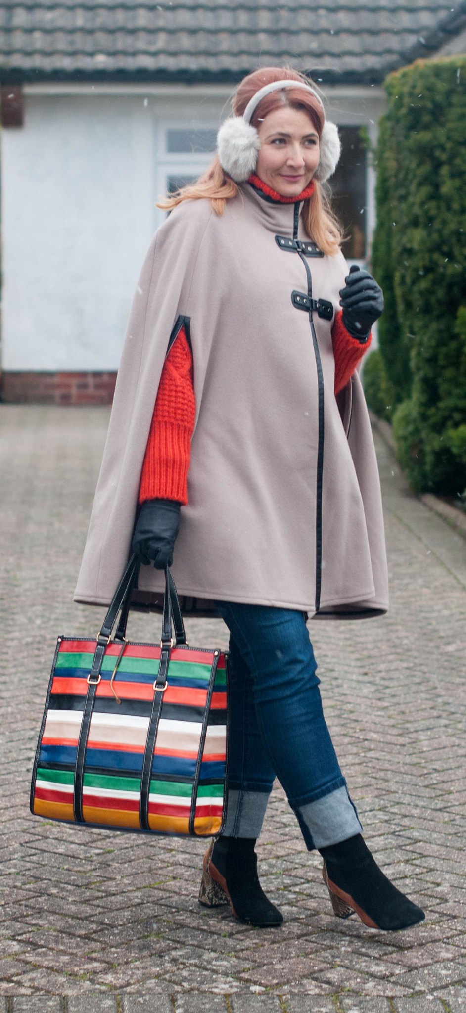 Elevated Outerwear: Chic Cape and Cozy Knit — Winter Outfits for Women Over 40