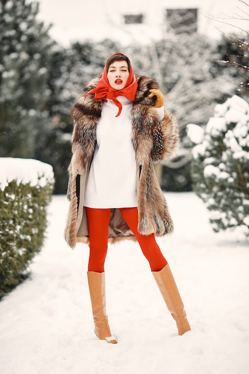 Luxurious Fur Coat Over White Dress with Red Accents — Winter Photoshoot Outfits