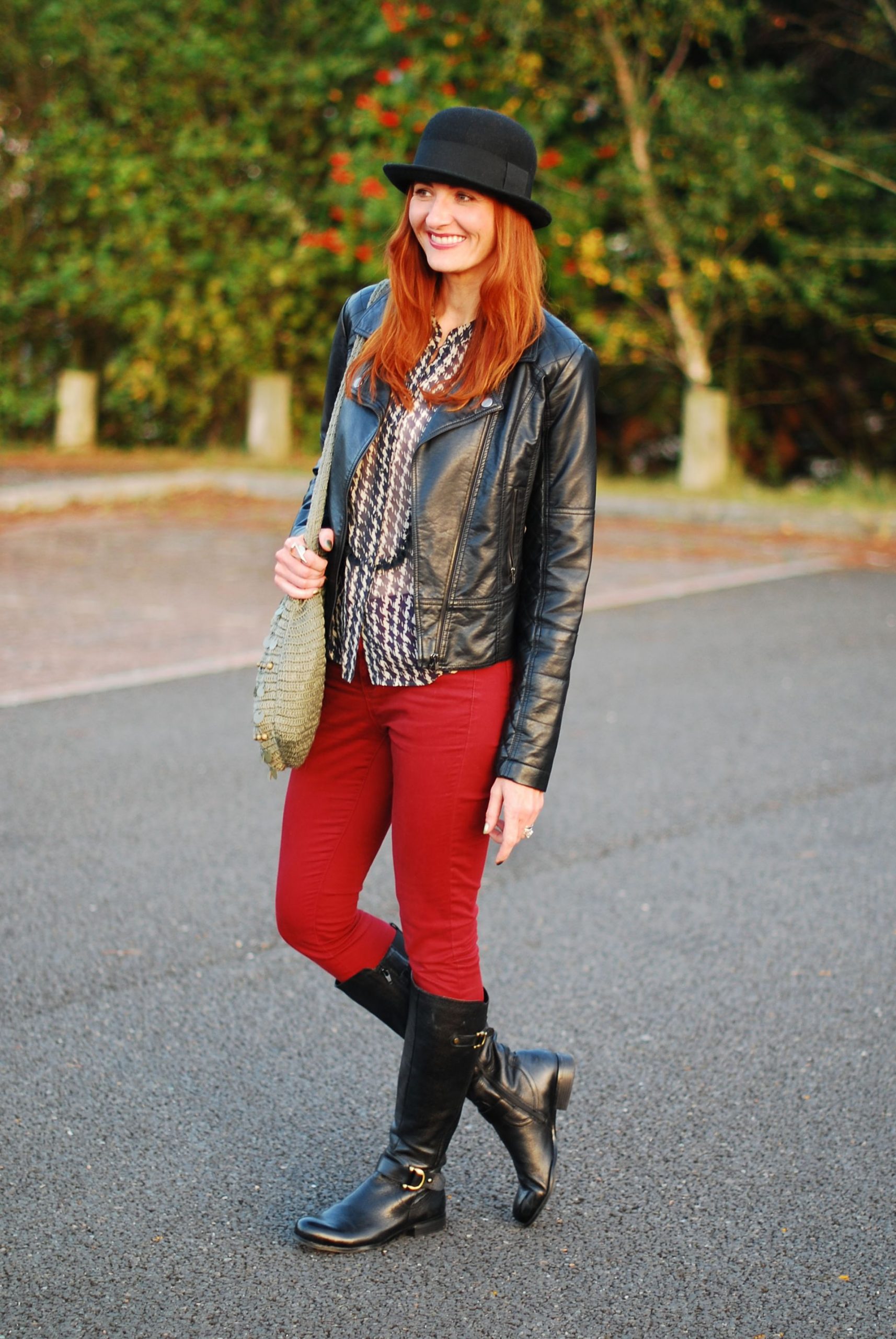 Bold Casual Statement: Black Boots with Red Jeans and Hat — Riding Boots Outfits