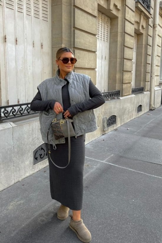 Cozy Layers: Quilted Vest Over Knit Dress Cozy Layers: Quilted Vest Over Knit Dress — Winter Travel Outfits