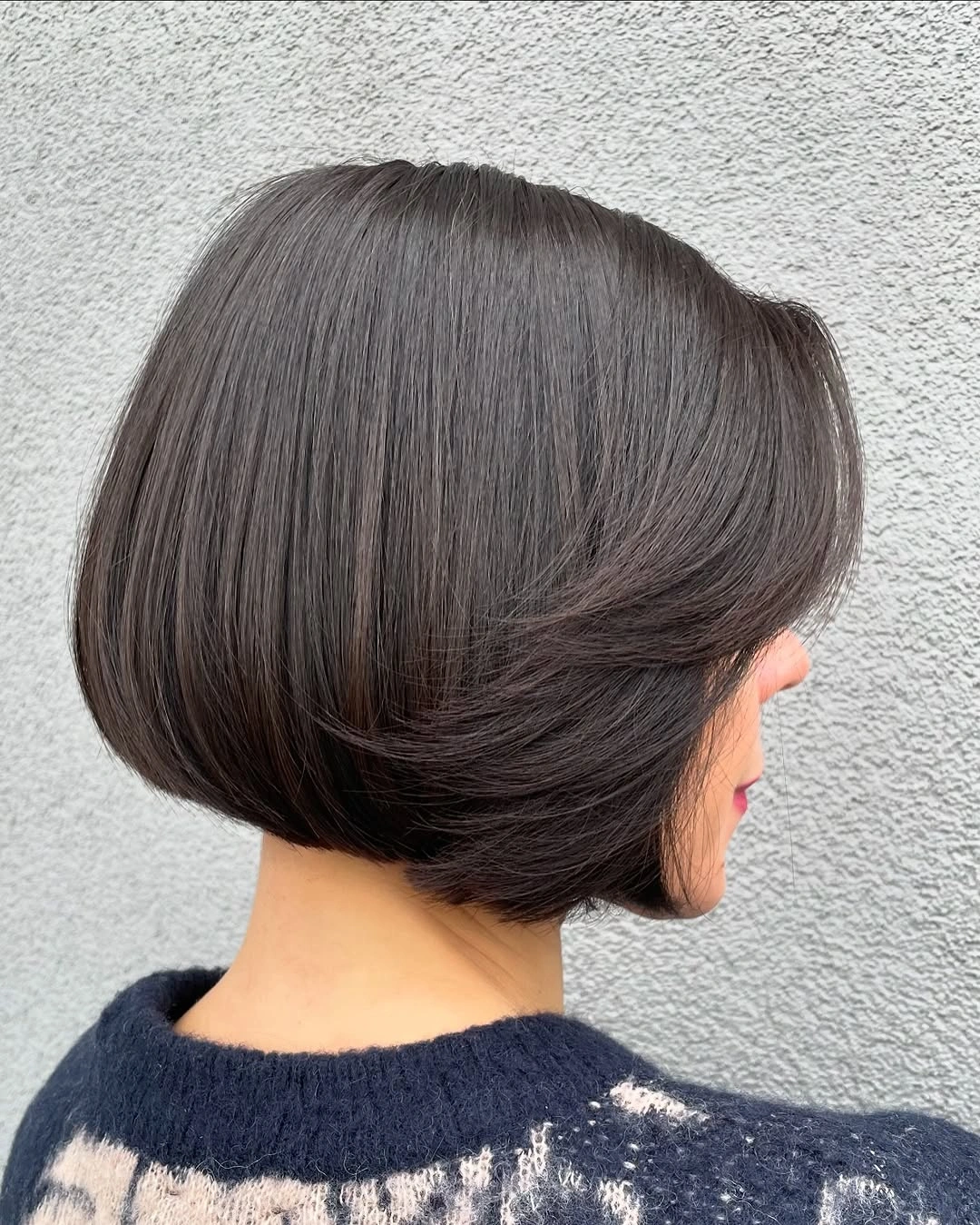 a-line bob haircuts Glossy Brunette Bob With a Sweeping Shape