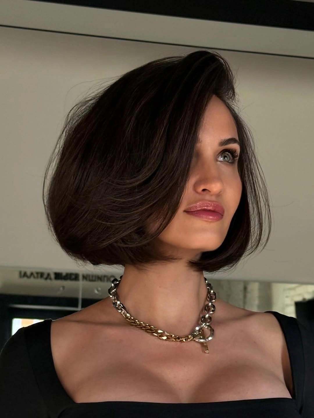 a-line bob haircuts Brunette Angled Bob With Side Swept Movement