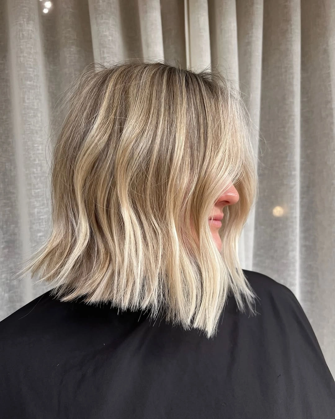 a-line bob haircuts Choppy Blonde Bob With Curtain Bangs and Lived In Waves