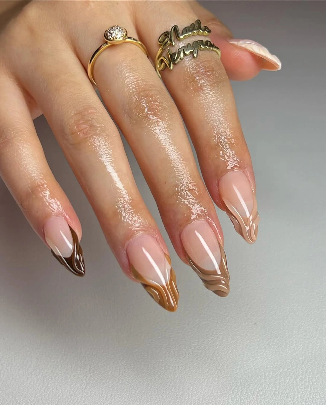 almond nails 2027 milky pink almond nails with delicate brown tips