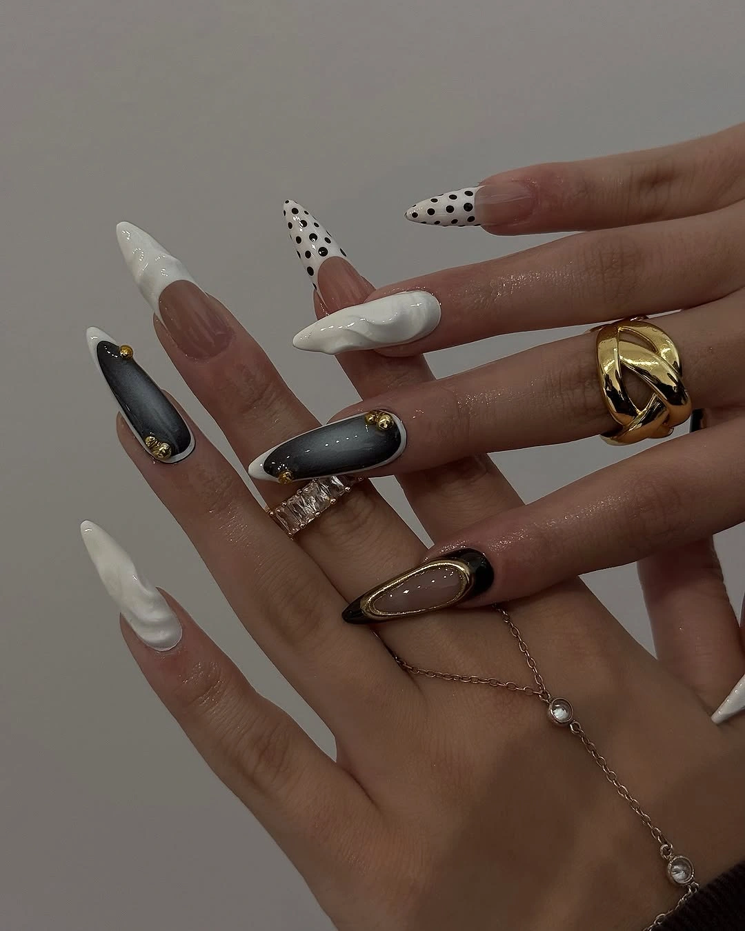 almond nails 2027 black white gold almond design