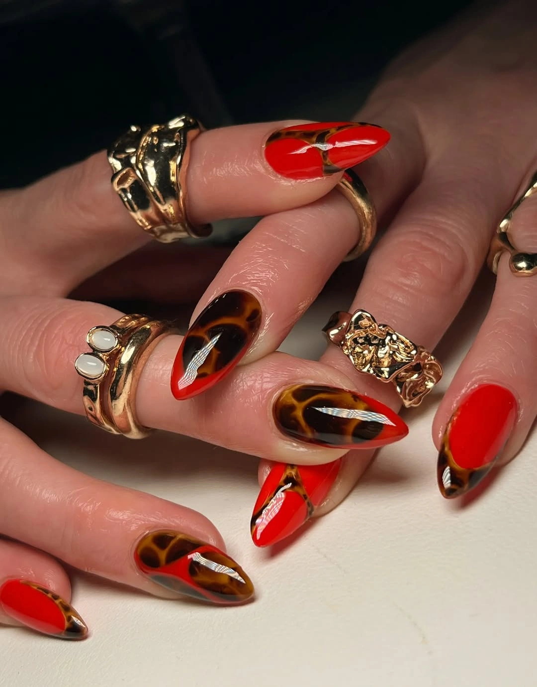 almond nails 2027 red tortoiseshell almond manicure