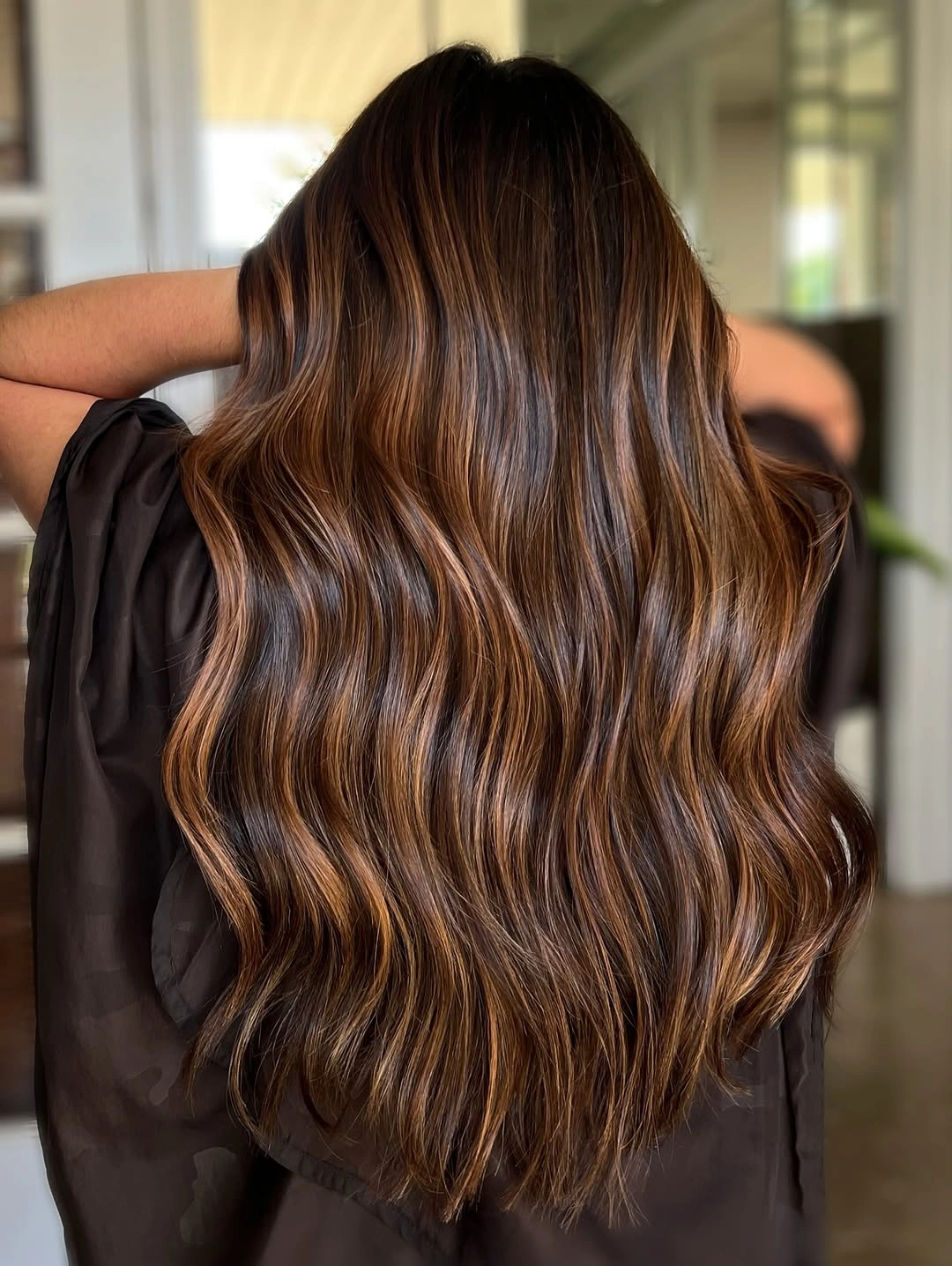 balayage on dark hair color Warm Caramel Waves With Golden Dimension