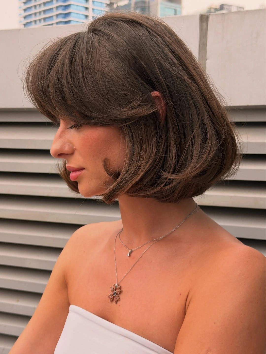 Bob with bangs haircut Voluminous Brunette Bob With Side Swept Bangs