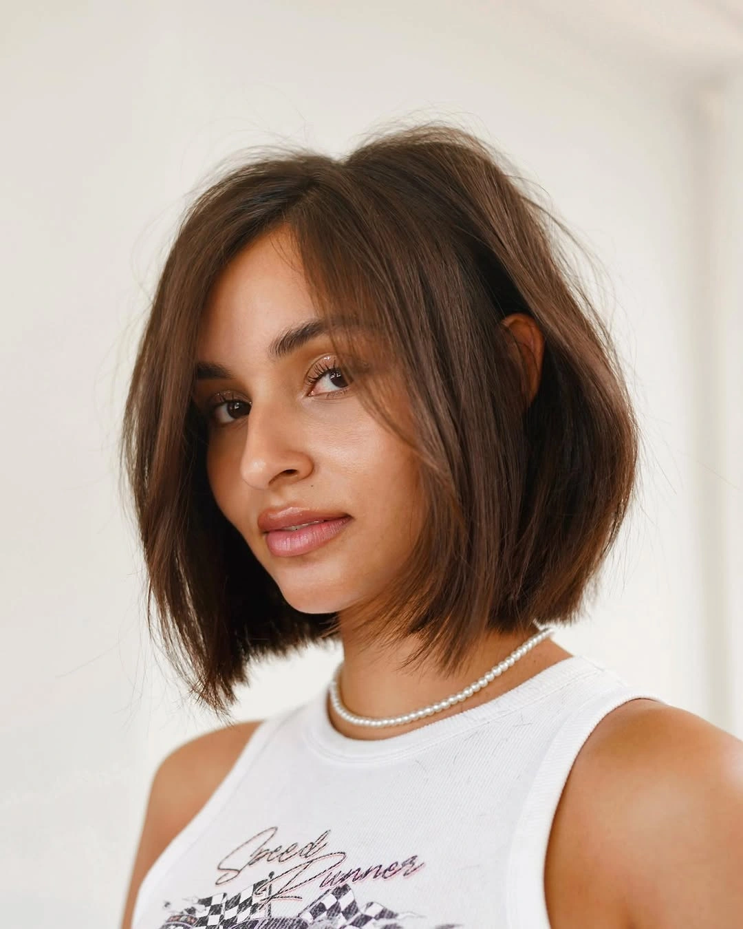 chic bobbed hair Glossy Brown Bob With Face Framing Layers
