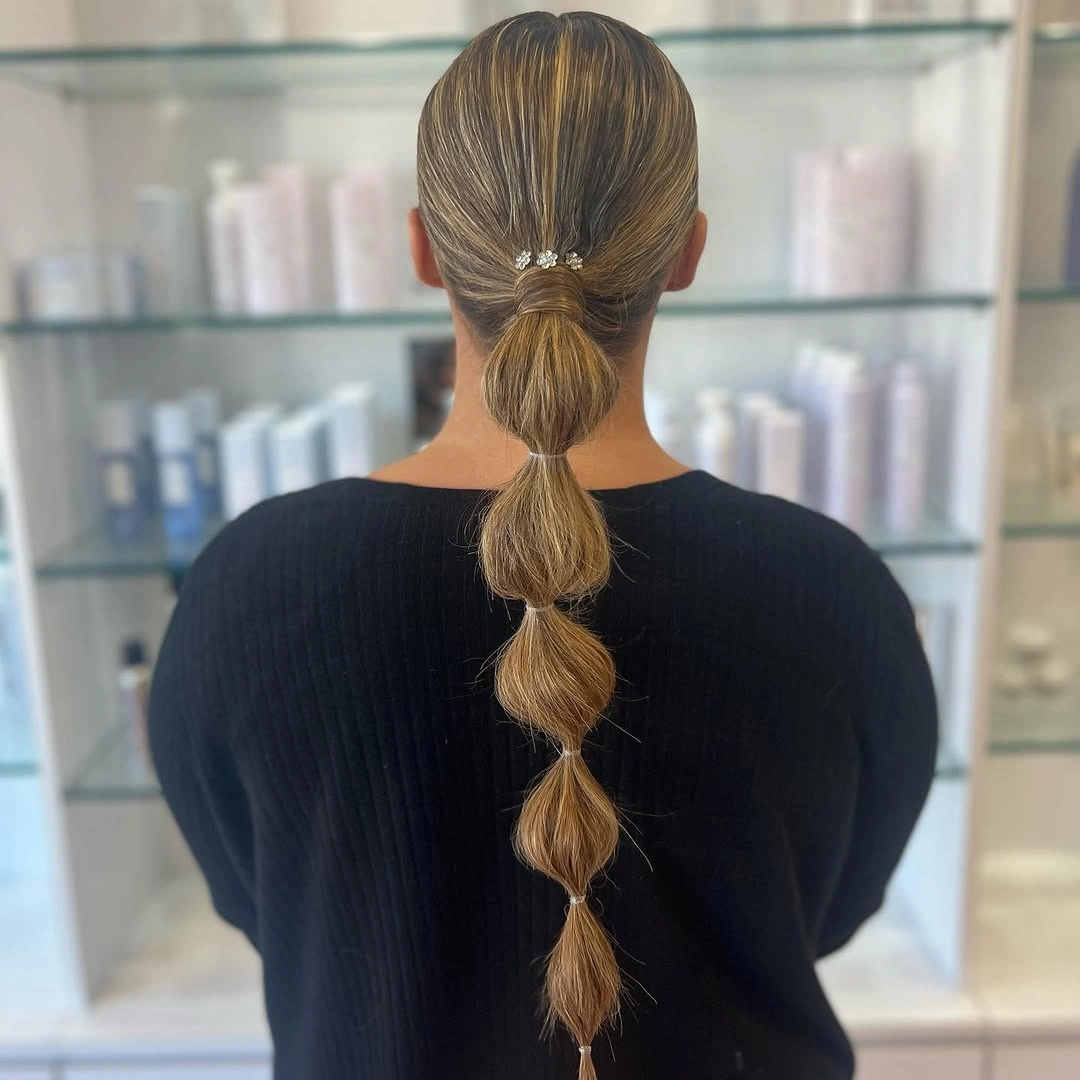 chic bubble braid hairstyle Polished Low Bubble Ponytail