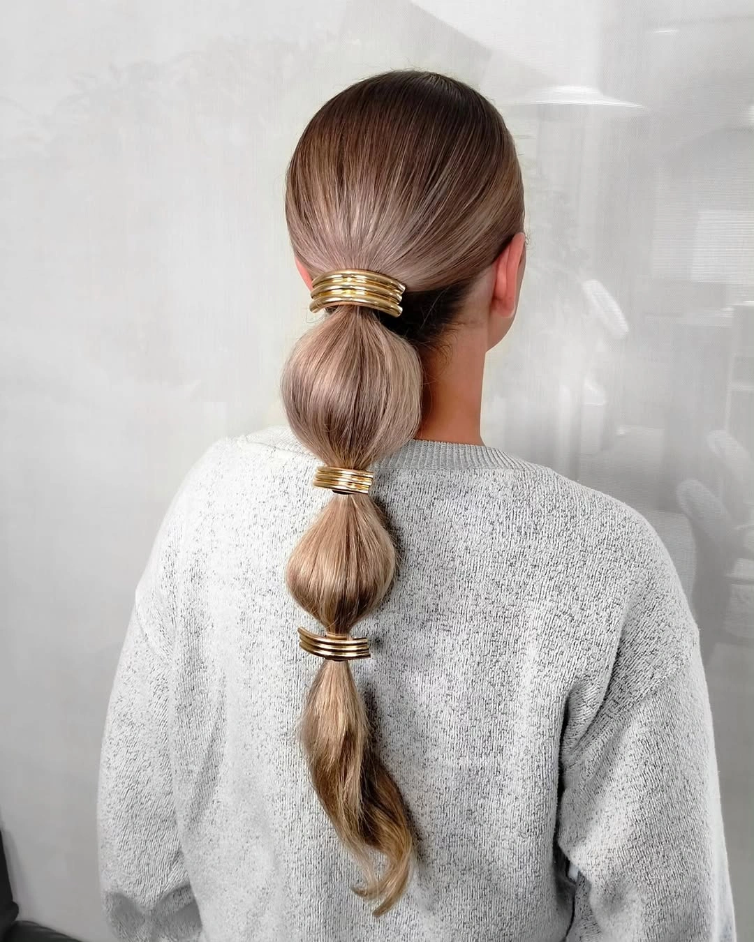 chic bubble braid hairstyle Minimal Gold Bubble Ponytail