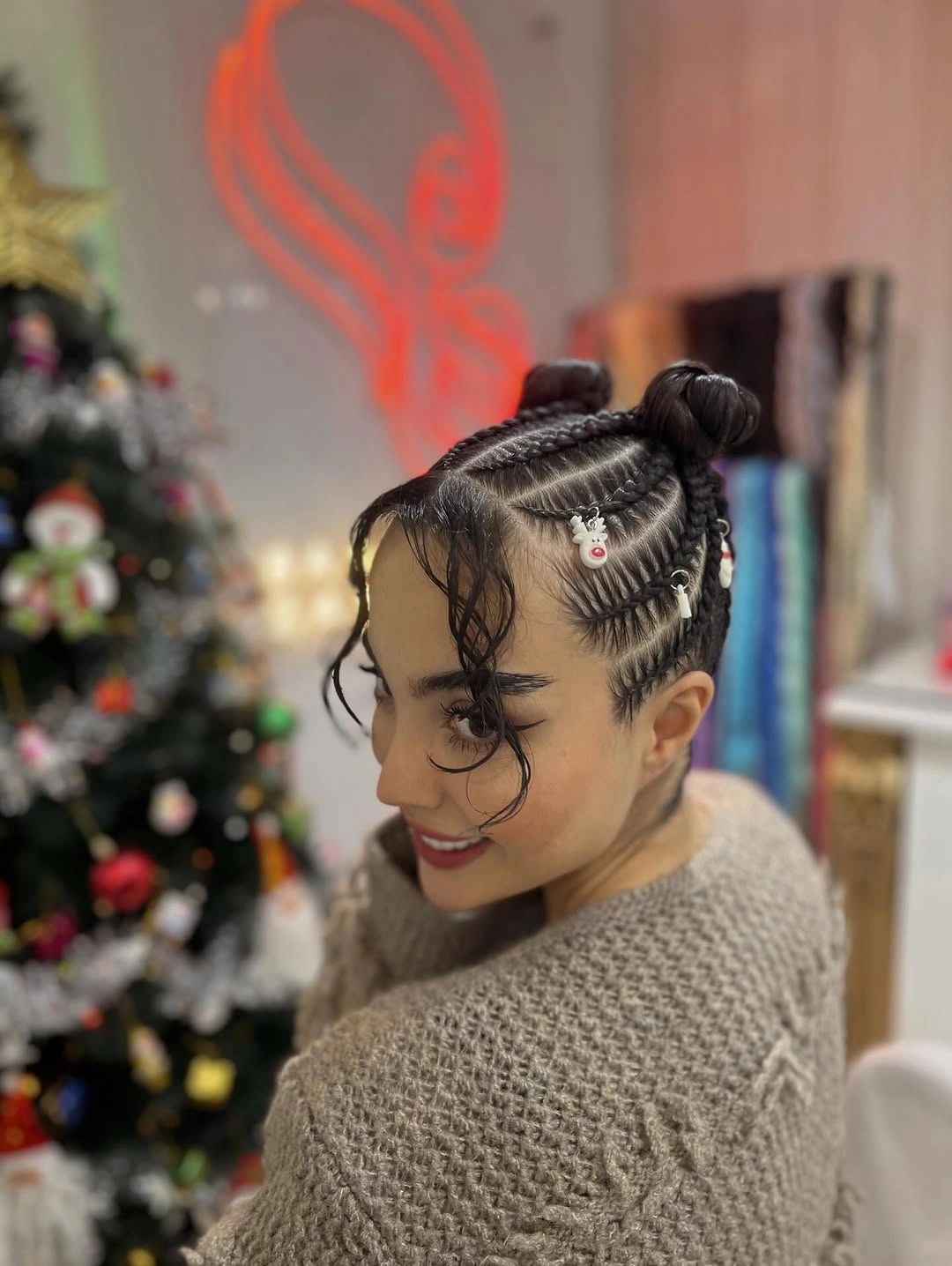 christmas hairstyles 2026 Double Braided Buns With Holiday Details