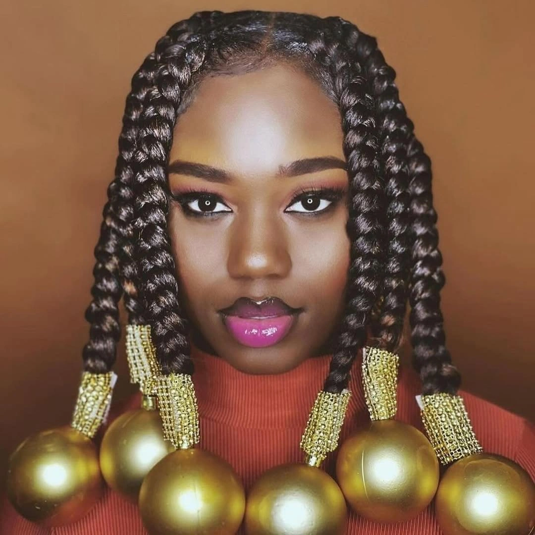 christmas hairstyles 2026 Statement Braids With Golden Ornaments