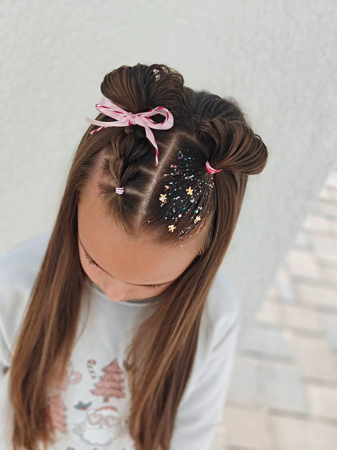 christmas hairstyles 2026 Playful Buns With A Ribbon And Sparkling Stars