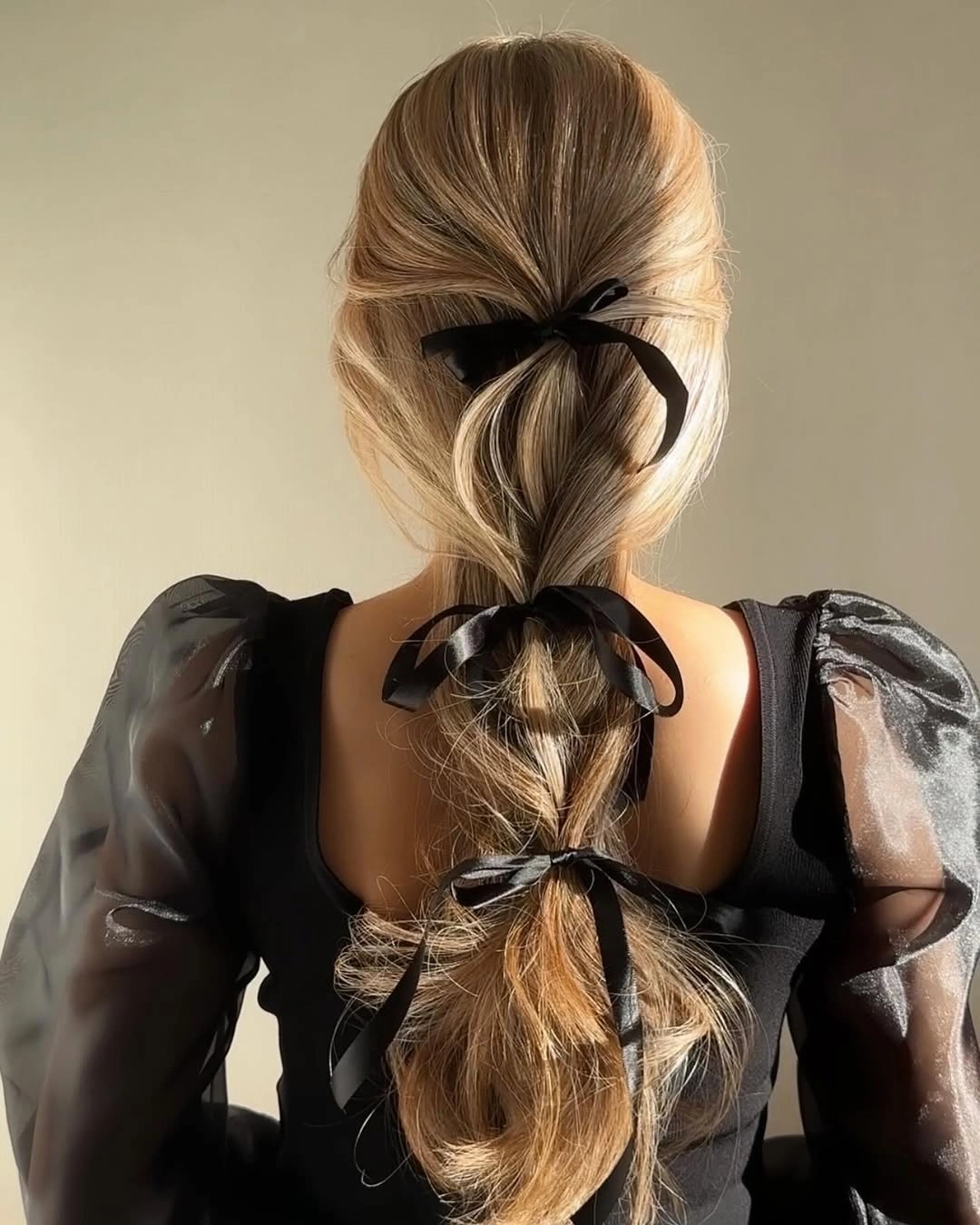 christmas hairstyles 2026 Elegant Bubble Ponytail With Black Ribbons