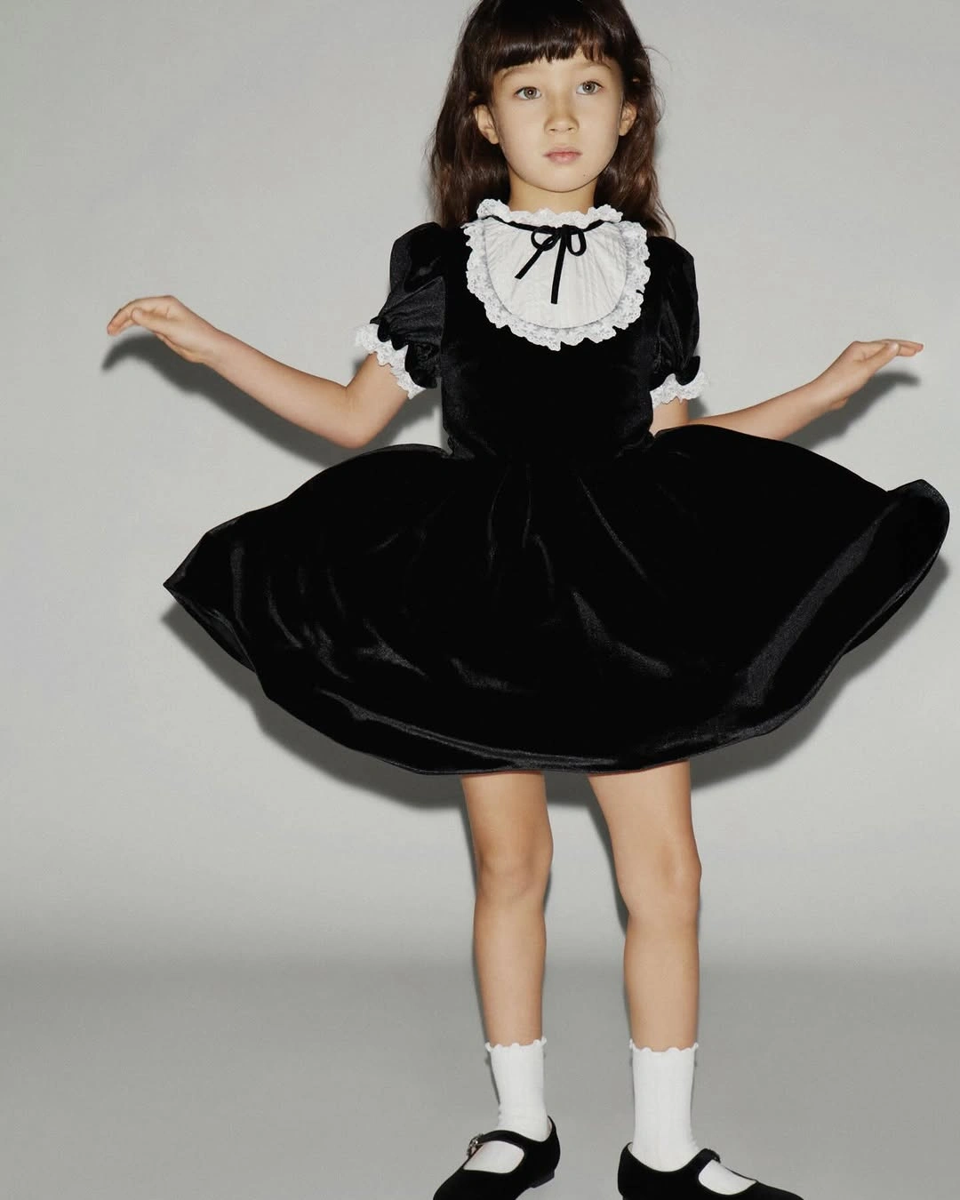 christmas outfits for kids 2026 Black Velvet Dress With A Classic Collar