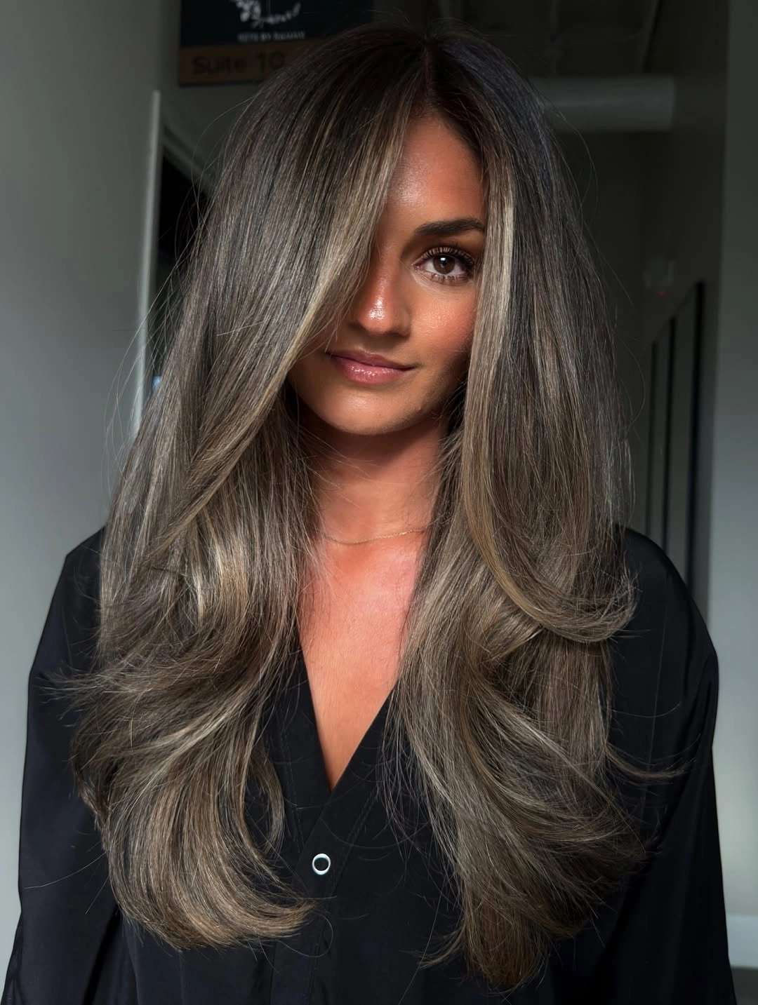 cozy winter hair color ideas for brunettes Smoky Mushroom Brunette With Soft Face Framing