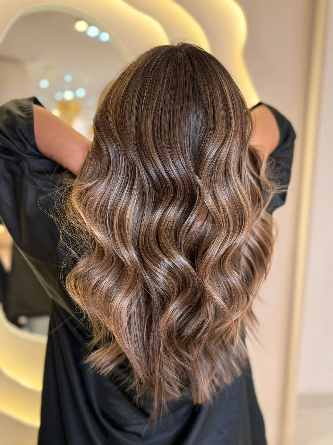 cozy winter hair color ideas for brunettes Soft Mocha Brown With Dimensional Waves