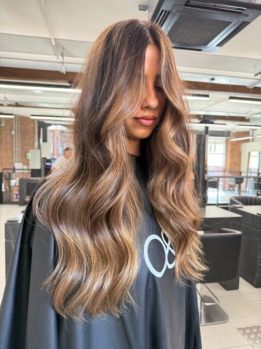 cozy winter hair color ideas for brunettes Caramel Balayage With Soft Face-Framing Light