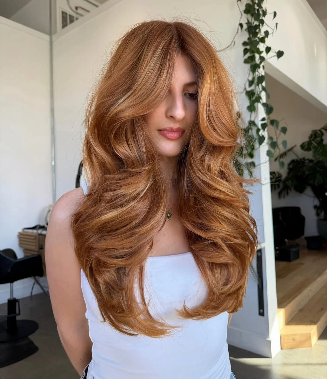 dyed hair for women Warm Copper Layers With A Soft Blowout