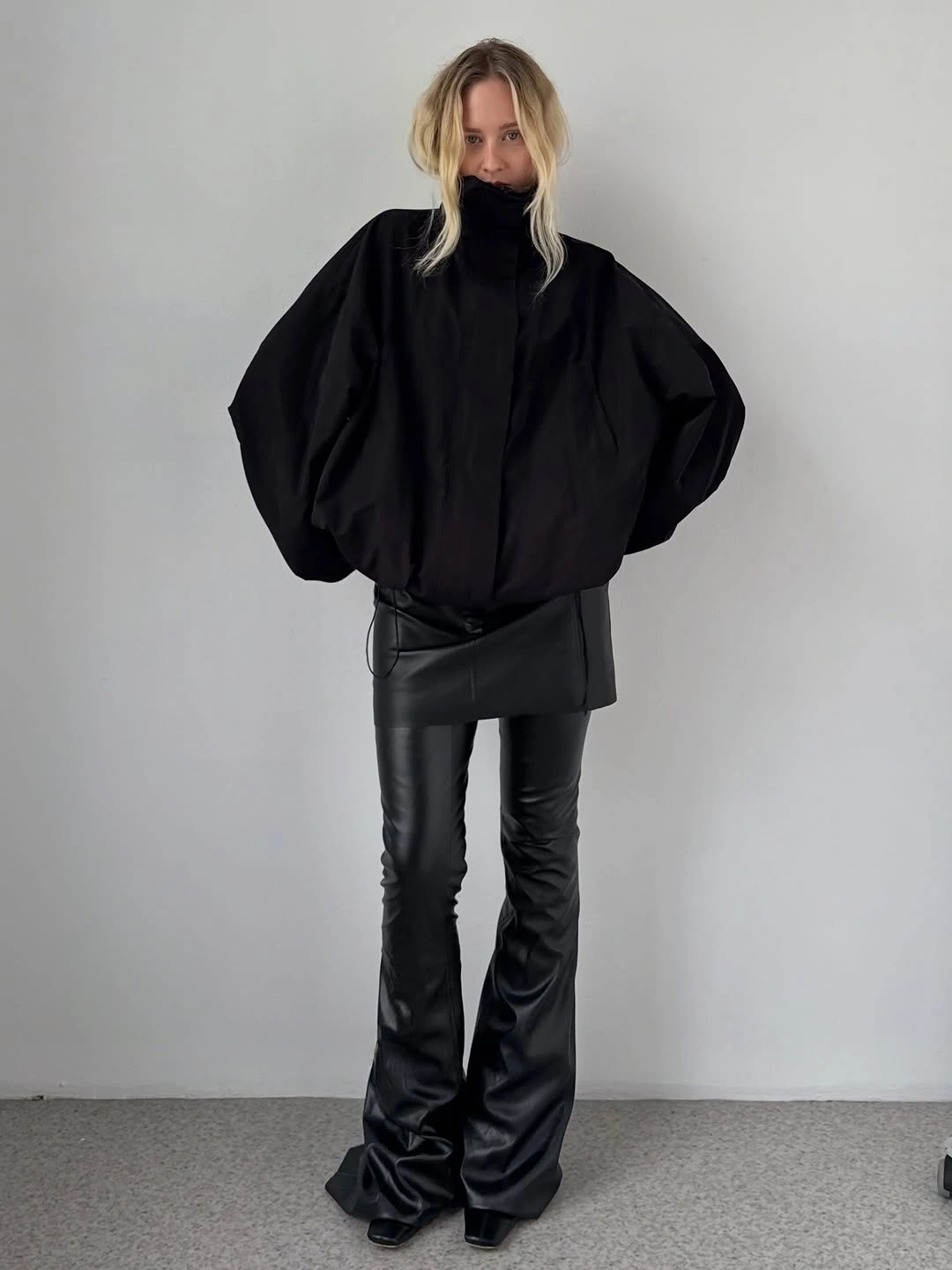 early winter outfits All Black With Sculptural Volume