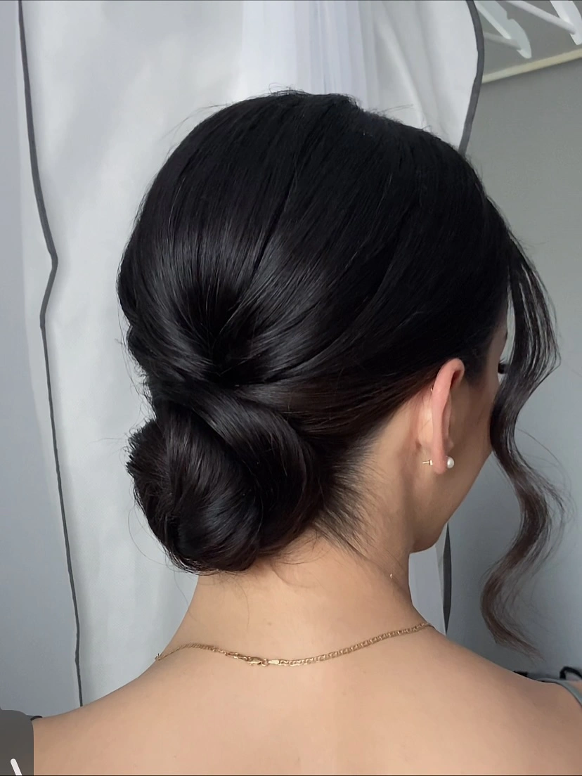 funeral hairstyles for women Sleek Low Chignon With Soft Face-Framing Waves
