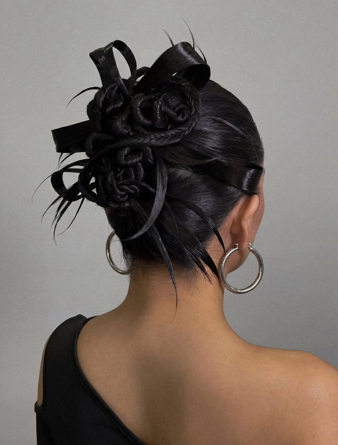 funeral hairstyles for women Artful Black Braided Updo With Sculptural Details