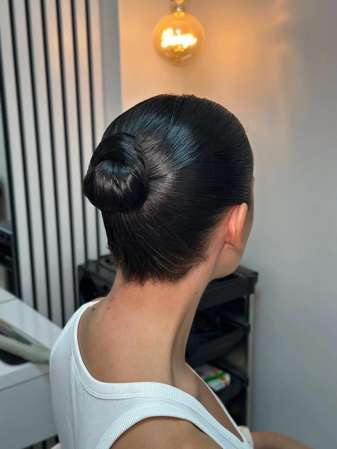 funeral hairstyles for women Sleek Low Bun For A Quiet Finish